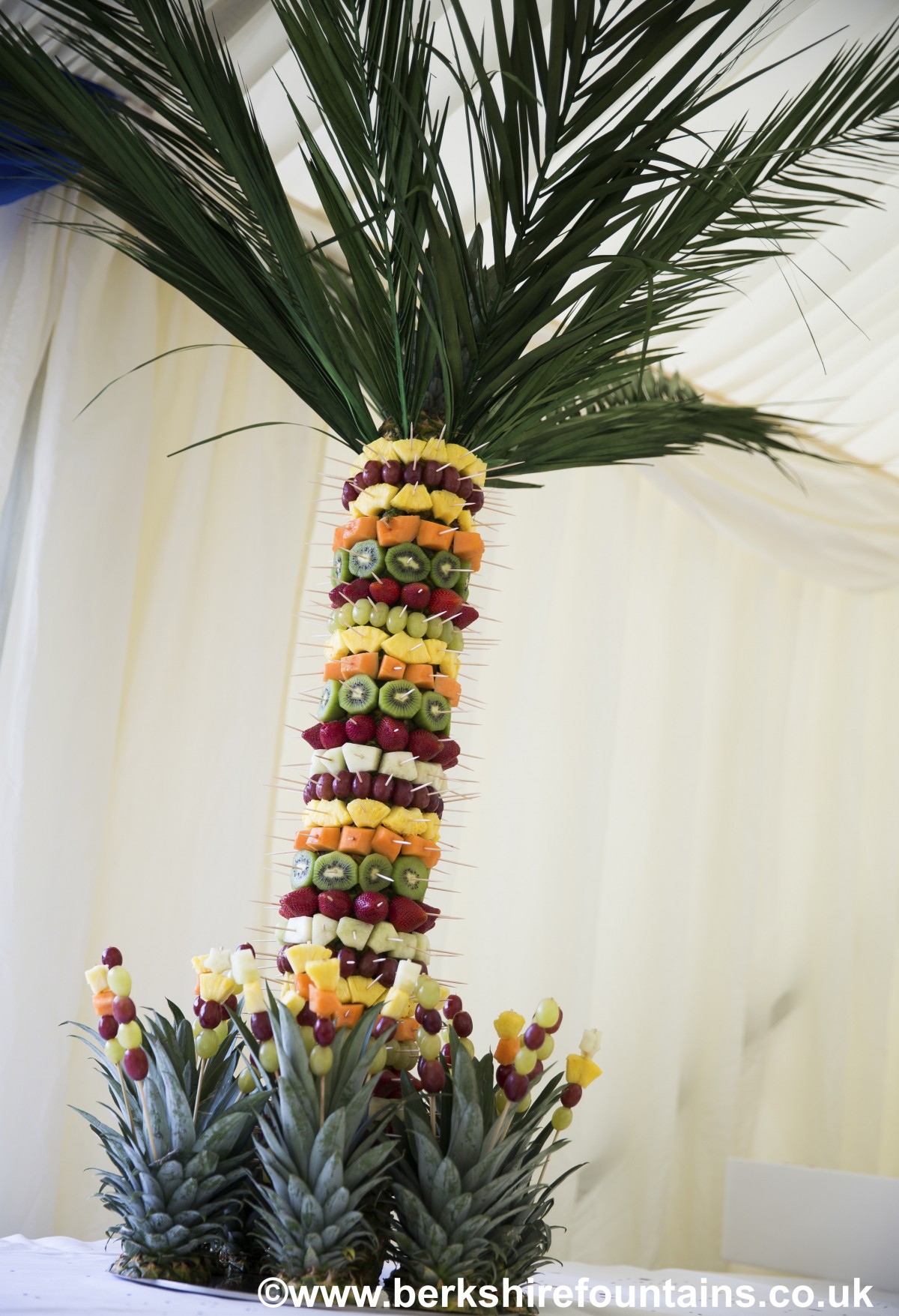 Pineapple Palm Tree Fruit Display : Buffet Enhancements Pineapple Tree Stand Large Ss Skewer With Sanilite Base 42 Includes 8 Palm Fronds Pro Restaurant Equipment - Fruit is attached around the bottom of the tree.
